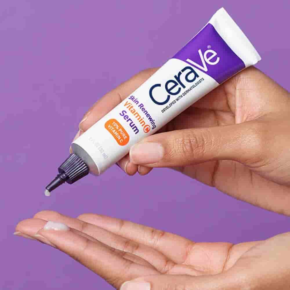 a women using cerave vitamin c face serum product 